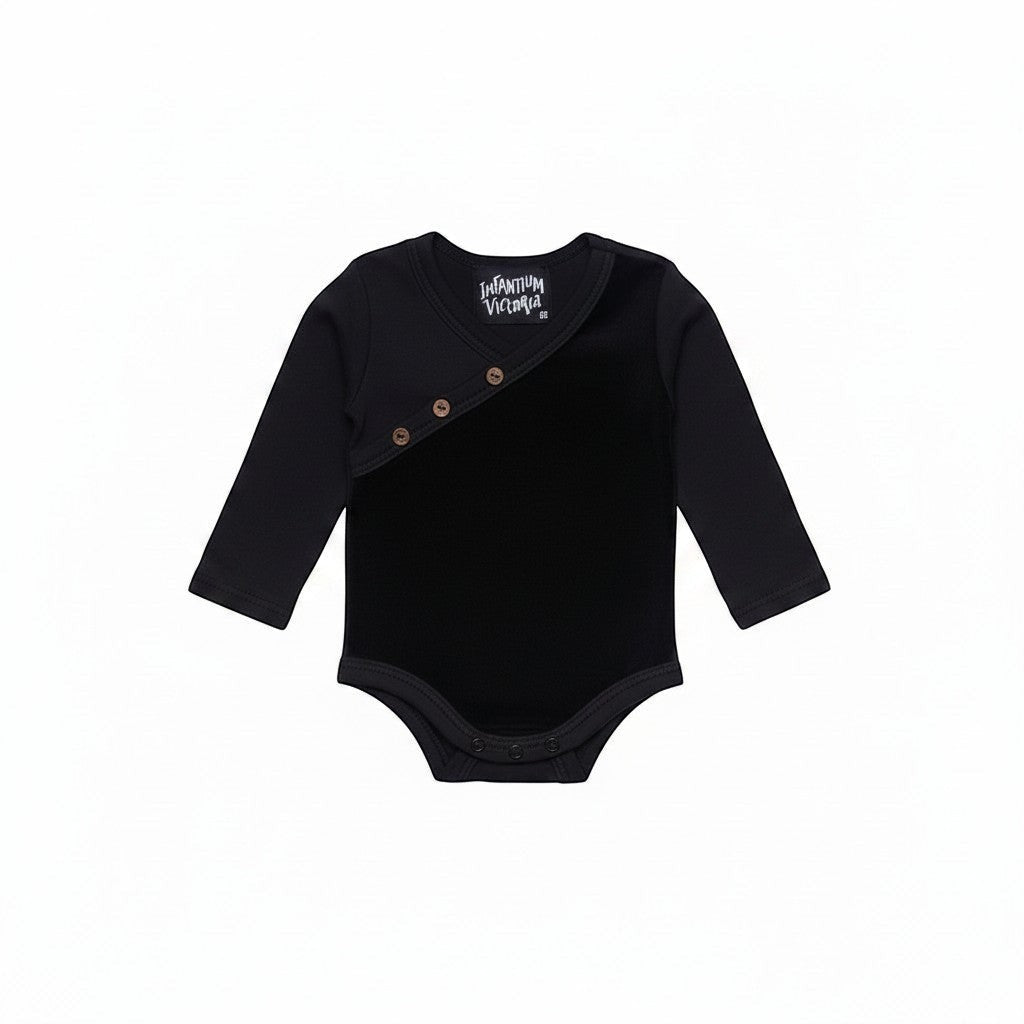 Infantium Victoria black organic cotton baby onesie with velvet detail and coconut shell buttons.